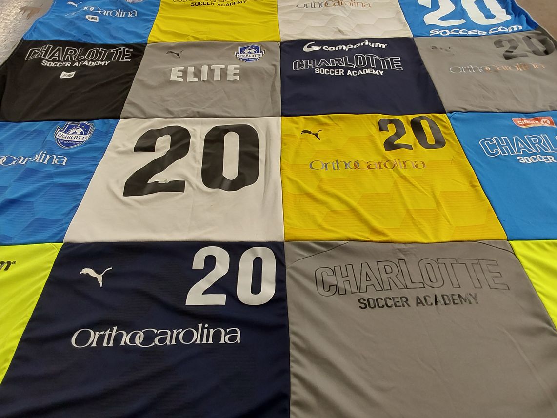 T-shirt quilt with soccer themes by Eve from NC