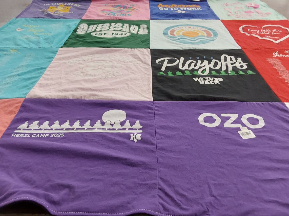 T-shirt quilt with camping, sports themes by Haley from MN