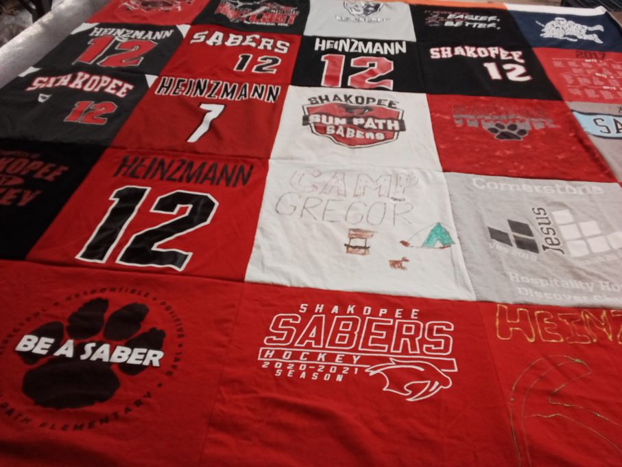 T-shirt quilt featuring shakopee sabers hockey by Jacinta from MN