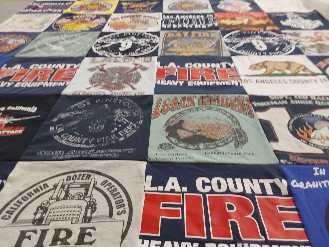 T-shirt quilt with firefighting, emergency services themes by Gina from CA