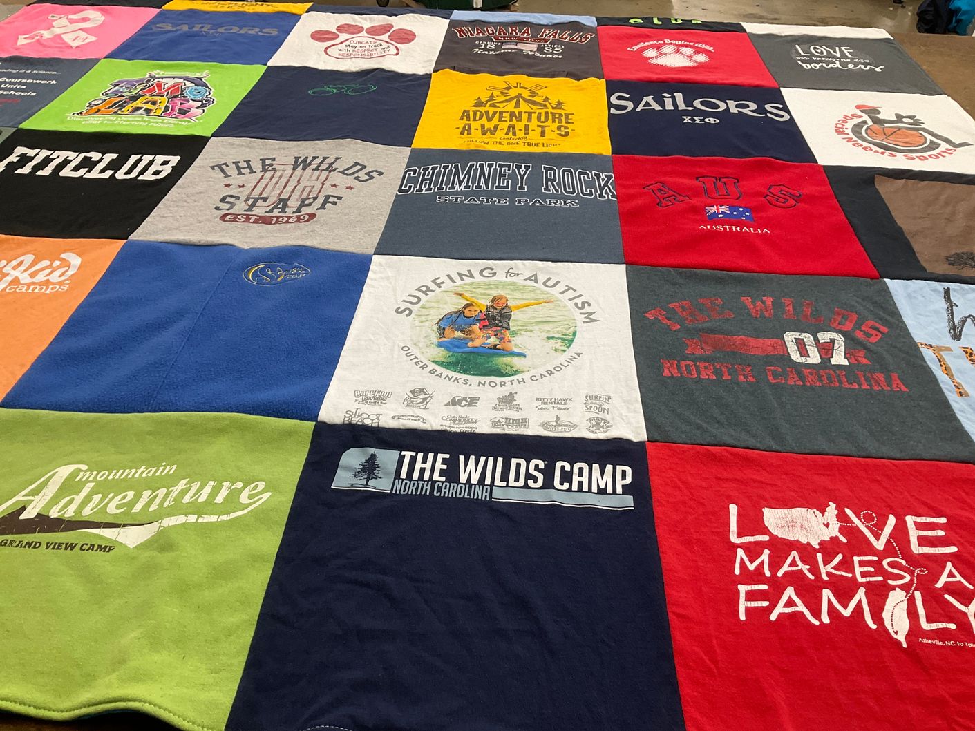 T-shirt quilt with camping, outdoor activities themes by Rebecca from NC