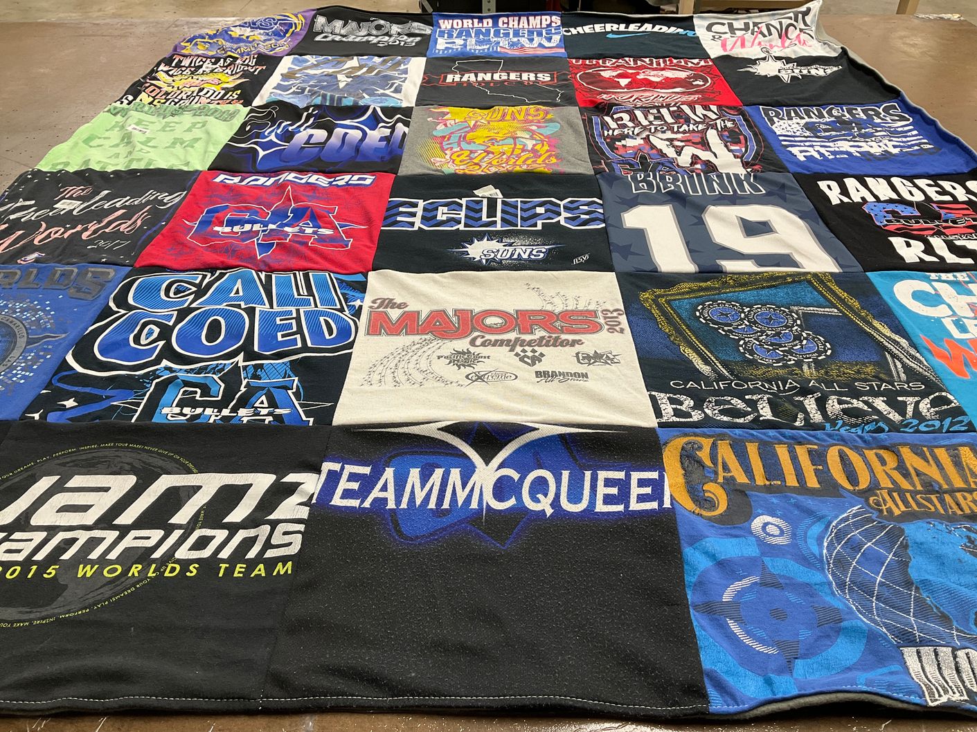 T-shirt quilt with cheerleading, sports themes by Dienna from CA