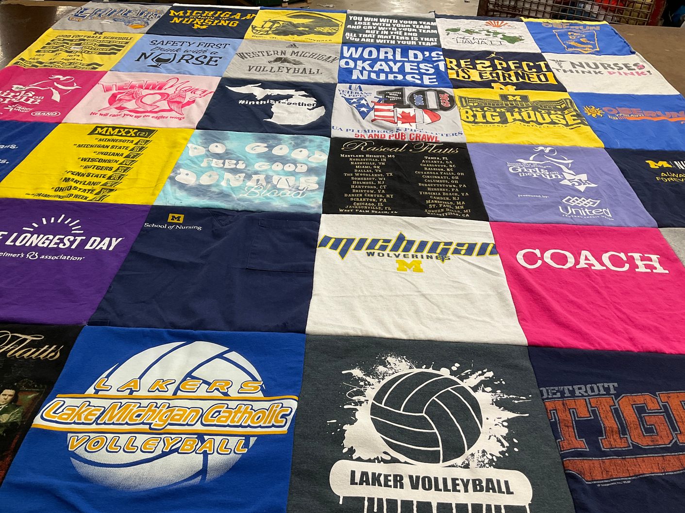 T-shirt quilt featuring lake michigan catholic high school volleyball, university of michigan wolverines volleyball by Alexandra from MI