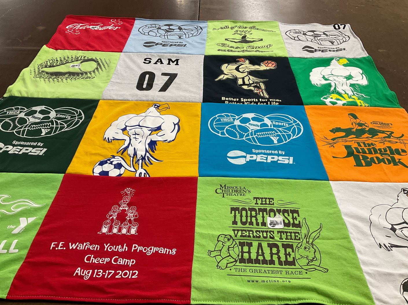 T-shirt quilt with sports, theatre themes by Amanda from WY