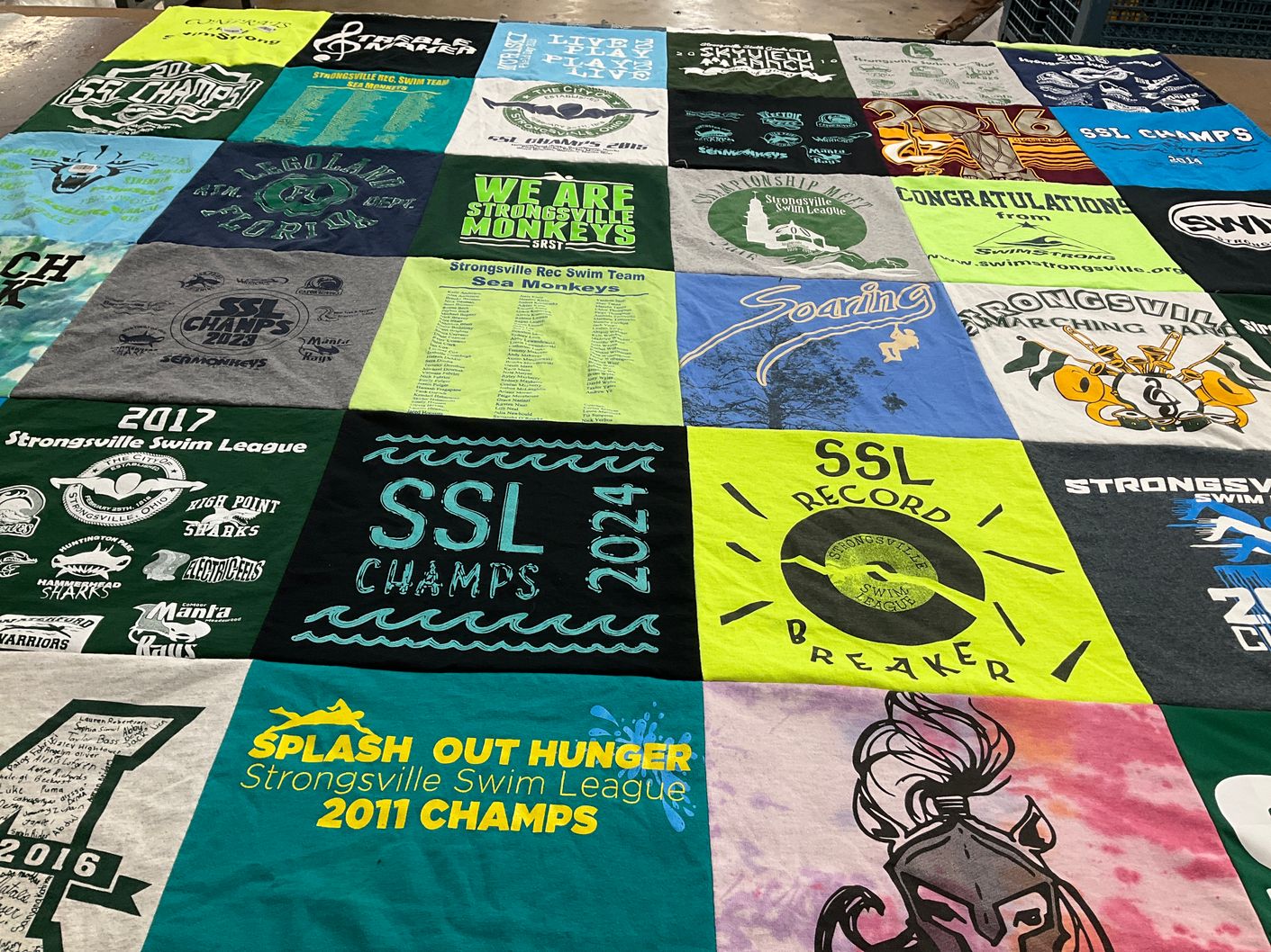 T-shirt quilt with swimming, youth sports themes by Kim from OH