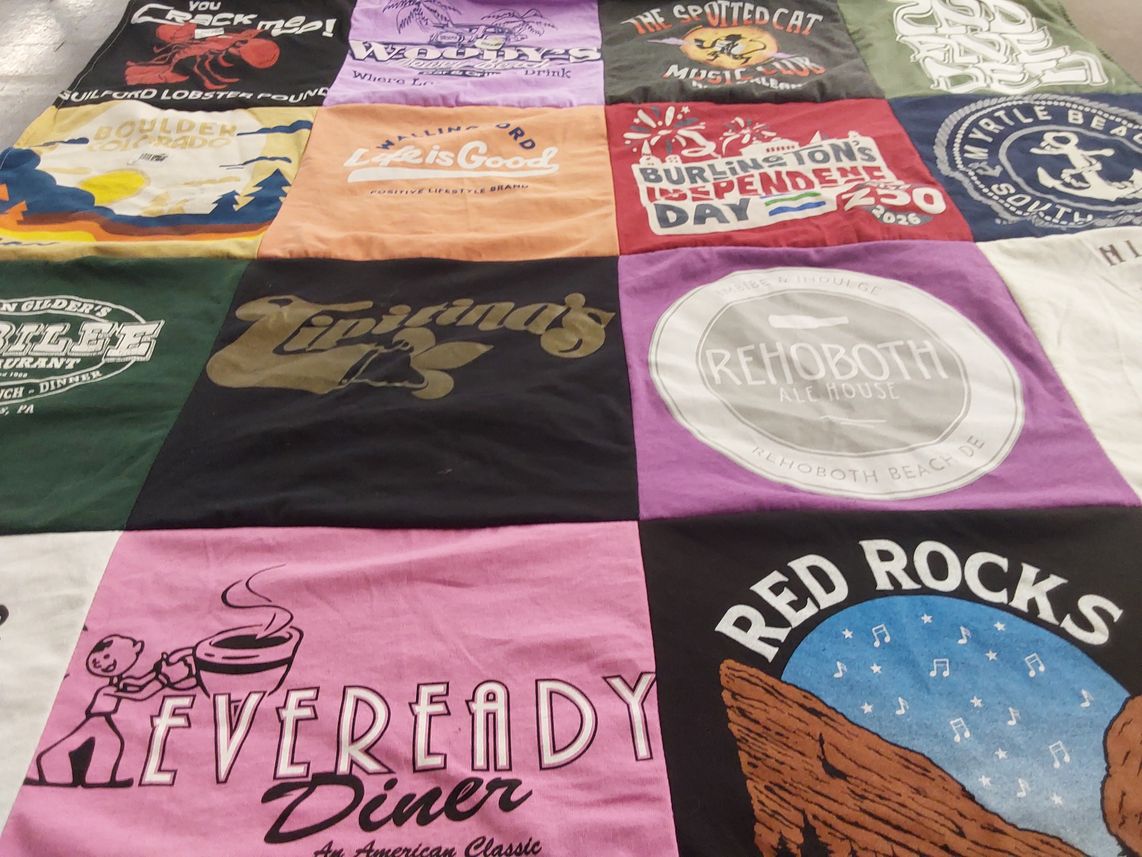 T-shirt quilt with local businesses, dining themes by Meredith from NY