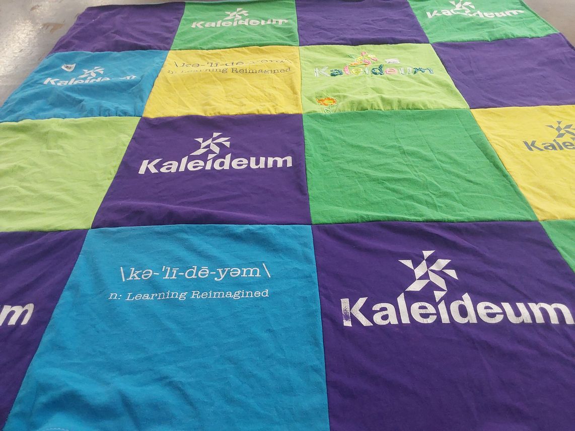 T-shirt quilt with education, learning themes by Tashara from NC