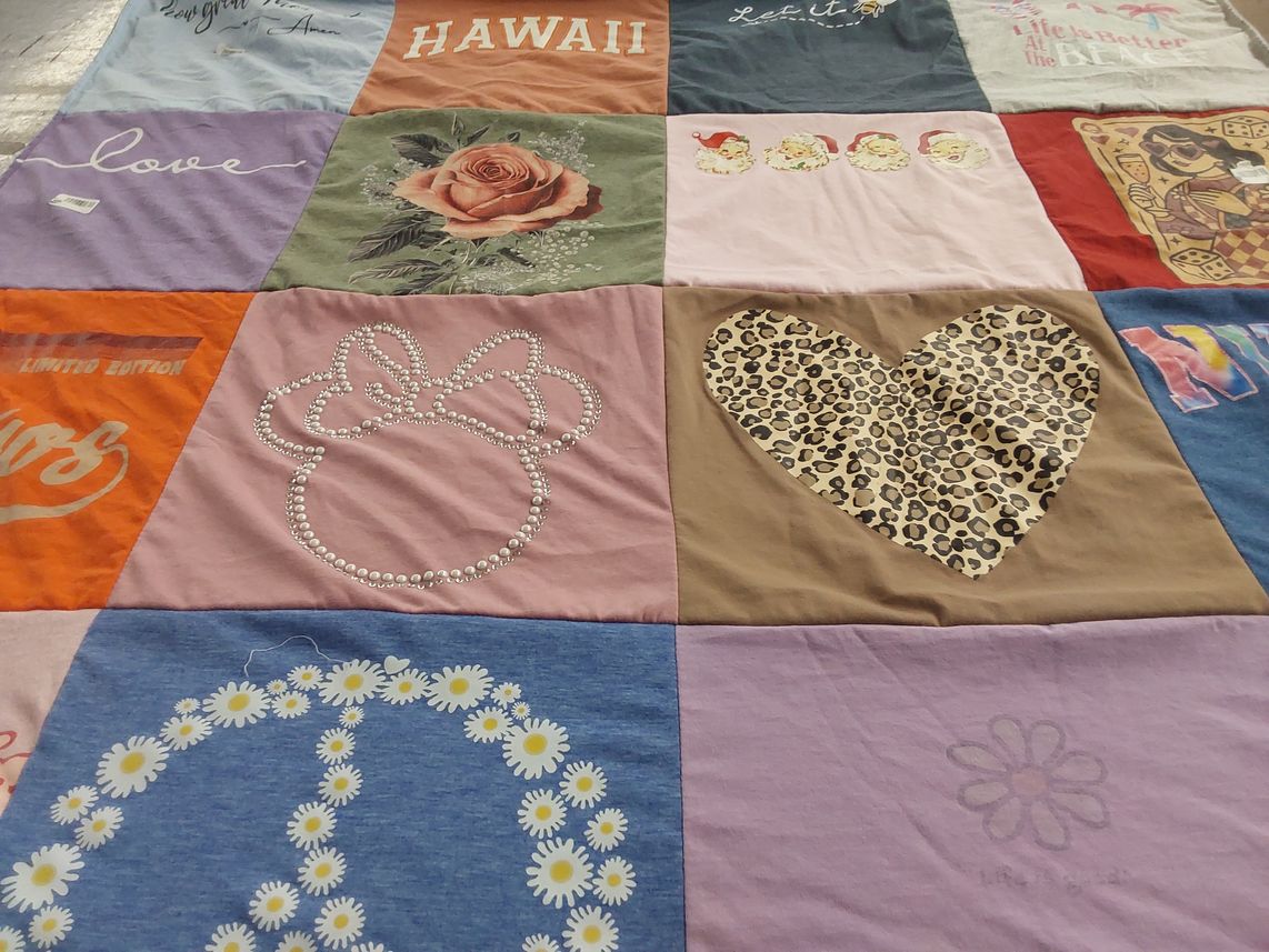 T-shirt quilt with travel, holidays themes by Sandra from TX