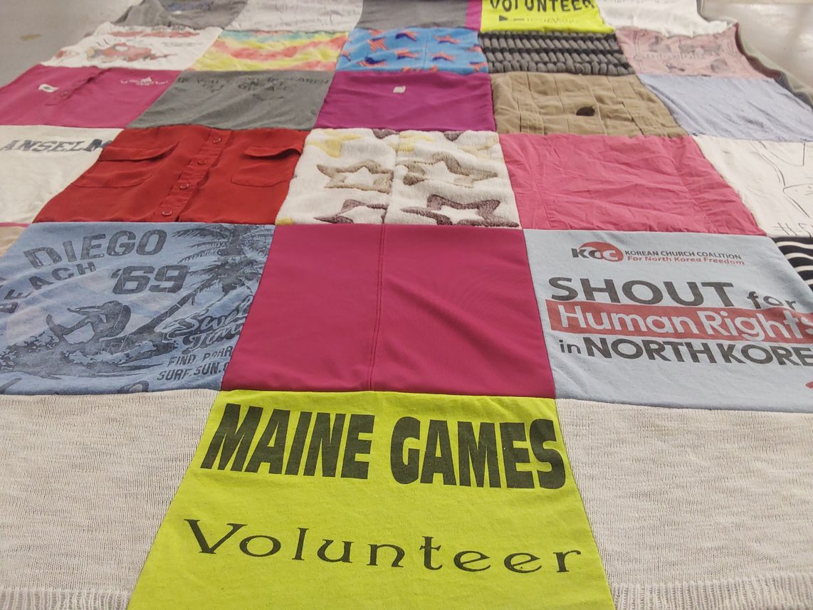 T-shirt quilt with human rights, volunteering themes by Olivia from DC