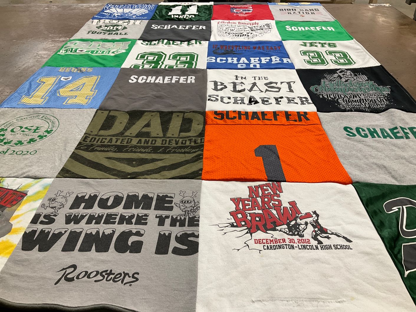 T-shirt quilt featuring brons wrestling by Heather from OH