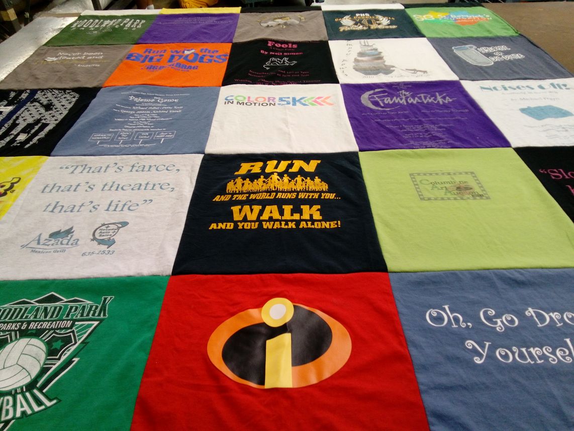 T-shirt quilt with theatre, running themes by Deborah from CO