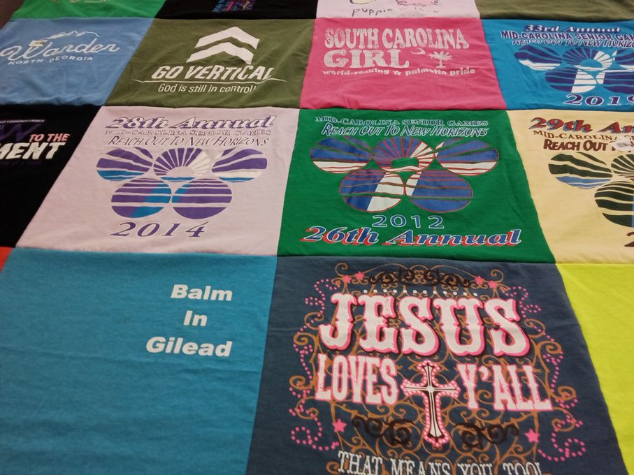 T-shirt quilt with community, religion themes by Pamela from NC