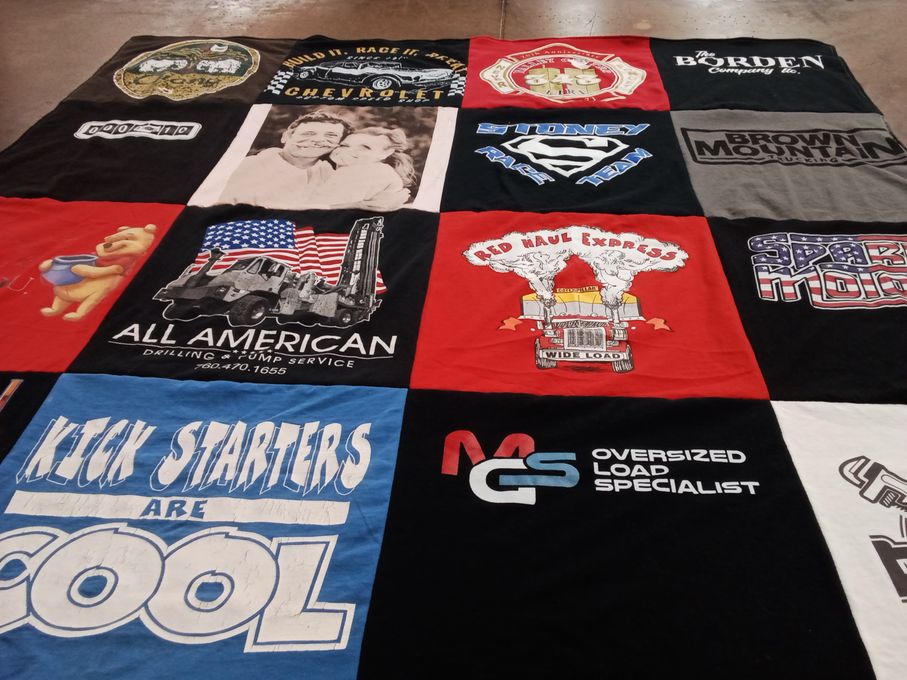 T-shirt quilt with trucking, drilling themes by Julie from CA