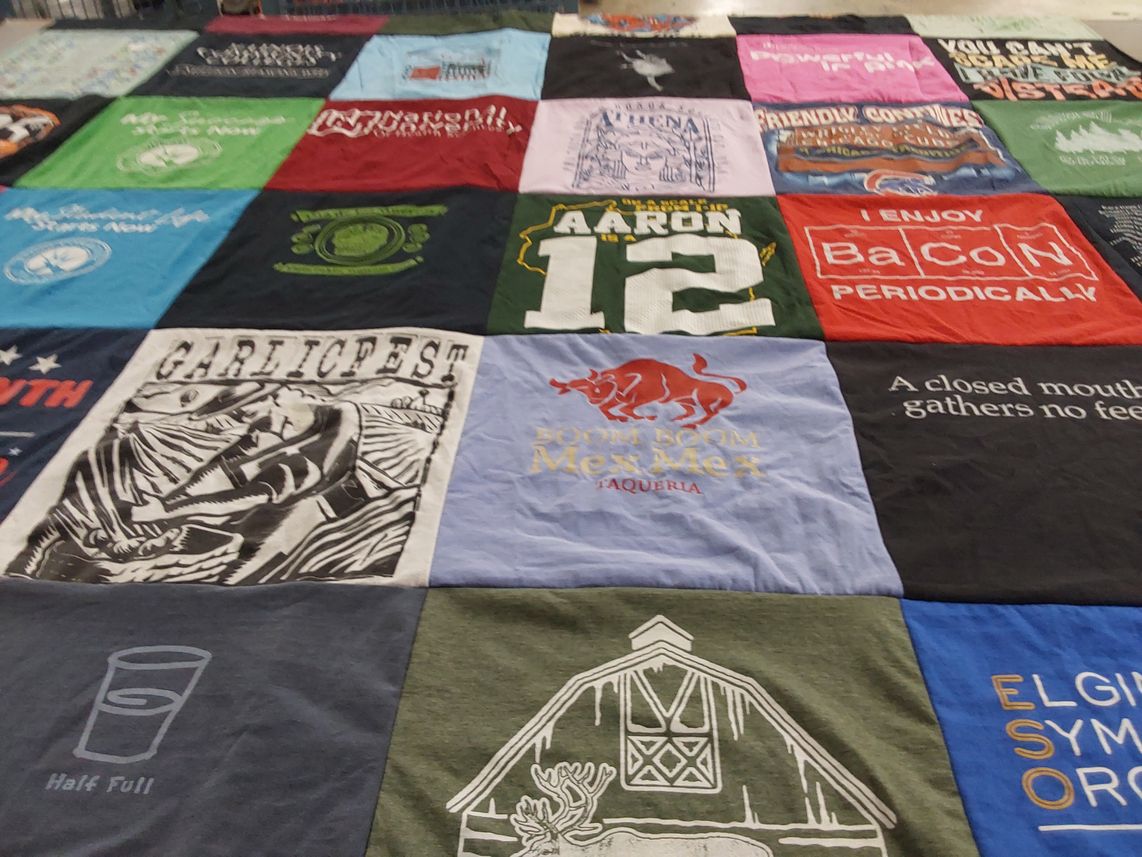 T-shirt quilt with food, festivals themes by Clare from IL