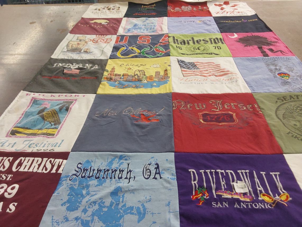 T-shirt quilt with travel, local culture themes by Joan from TX