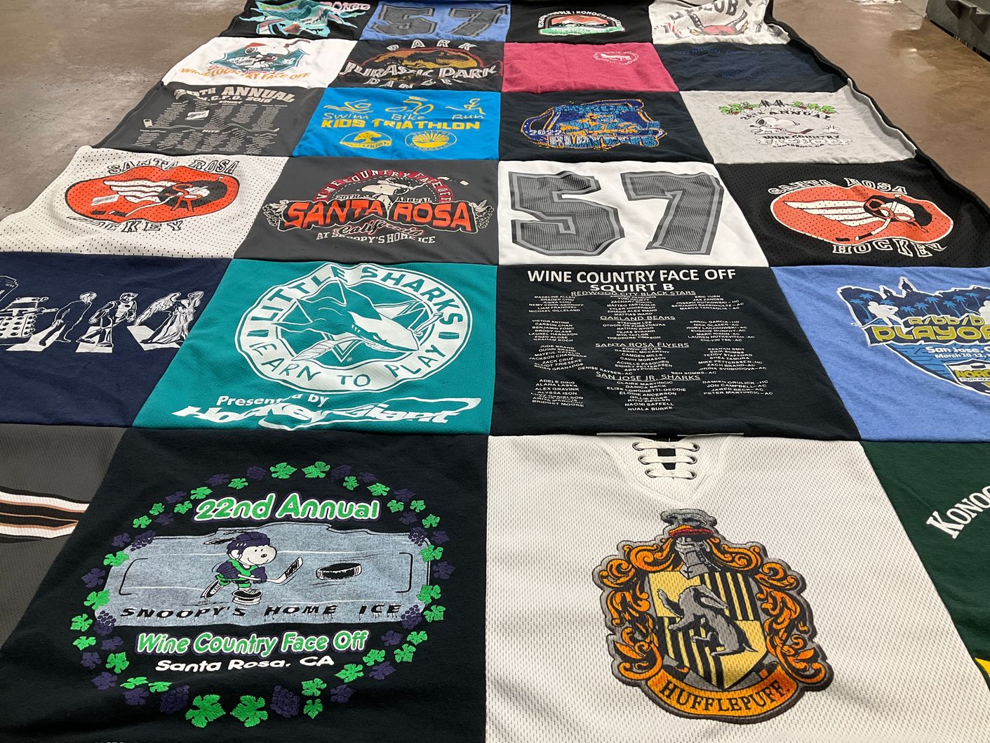 T-shirt quilt with hockey, ice skating themes by Deborah from CA