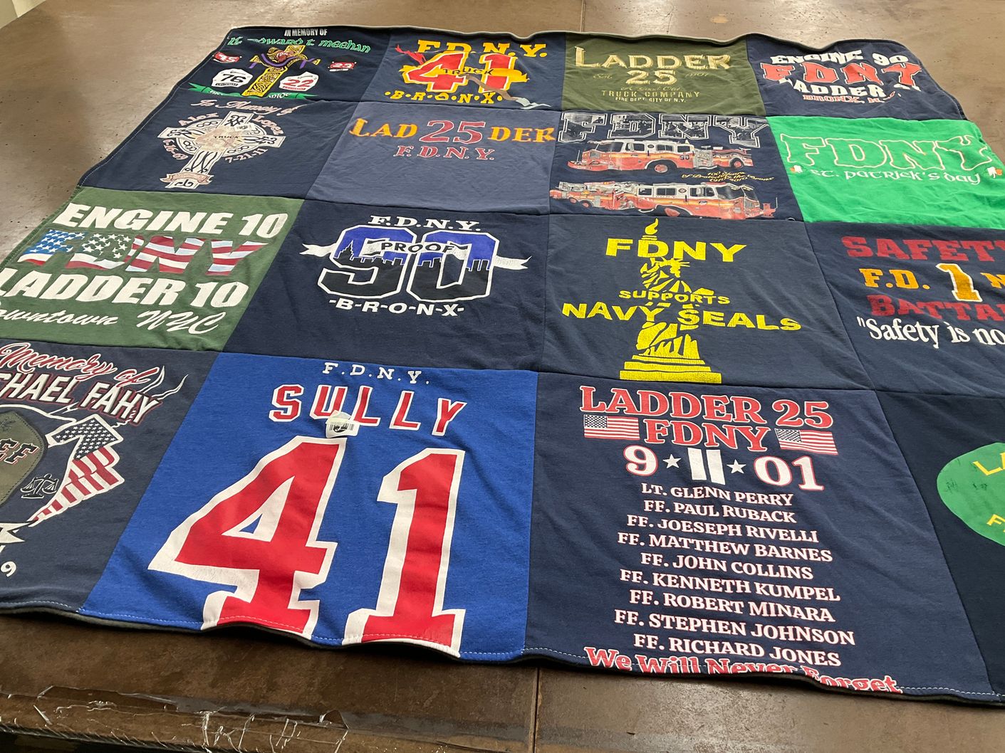 T-shirt quilt with firefighting, emergency services themes by Pamela from NY