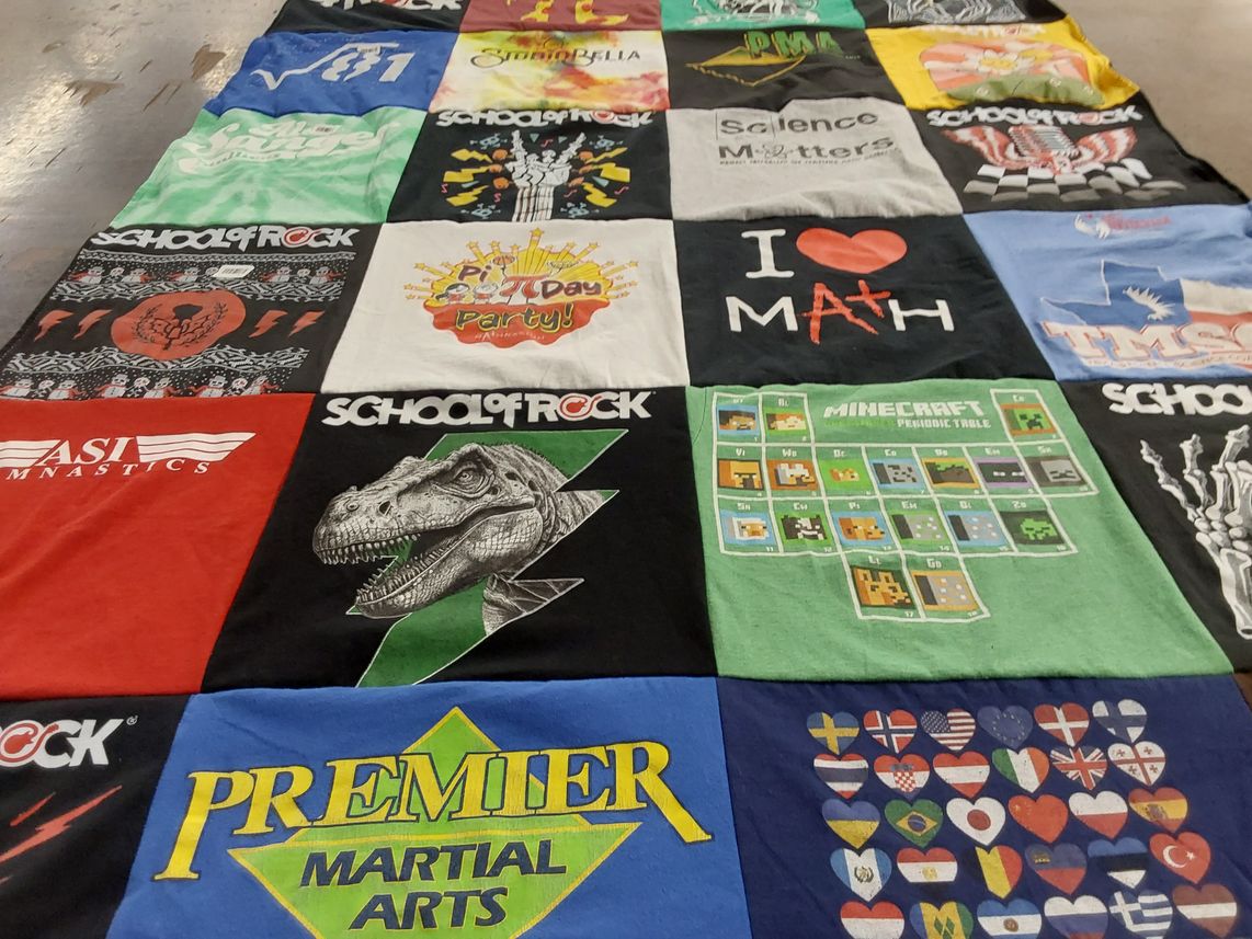 T-shirt quilt with music, education themes by Andra from TX