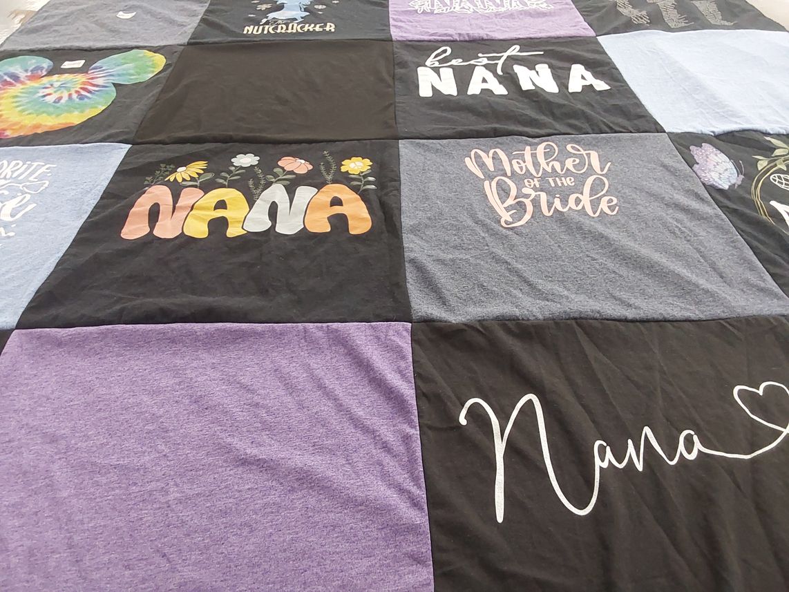 T-shirt quilt with family, celebration themes by Laurie from OR