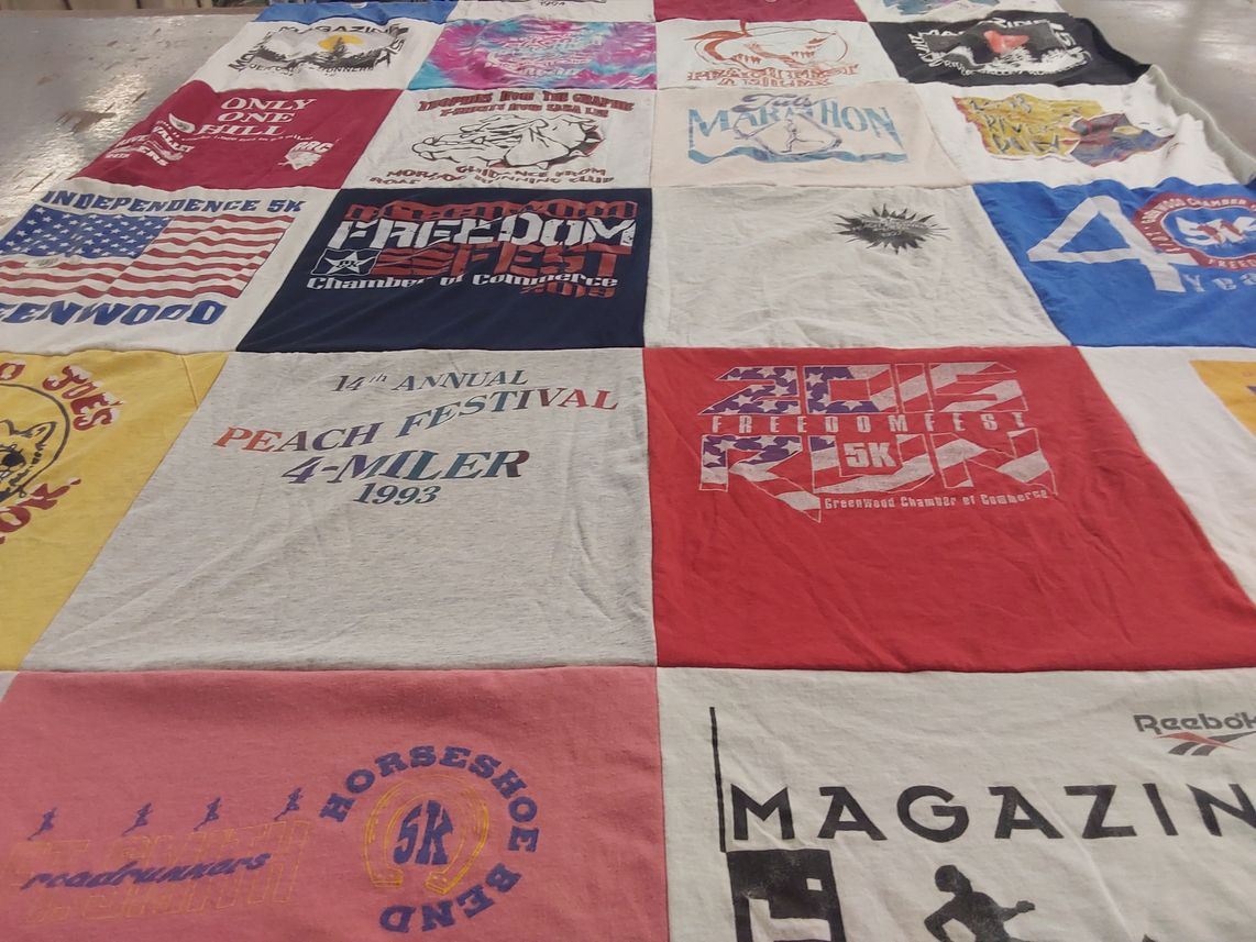 T-shirt quilt with running, festivals themes by Joan from AR
