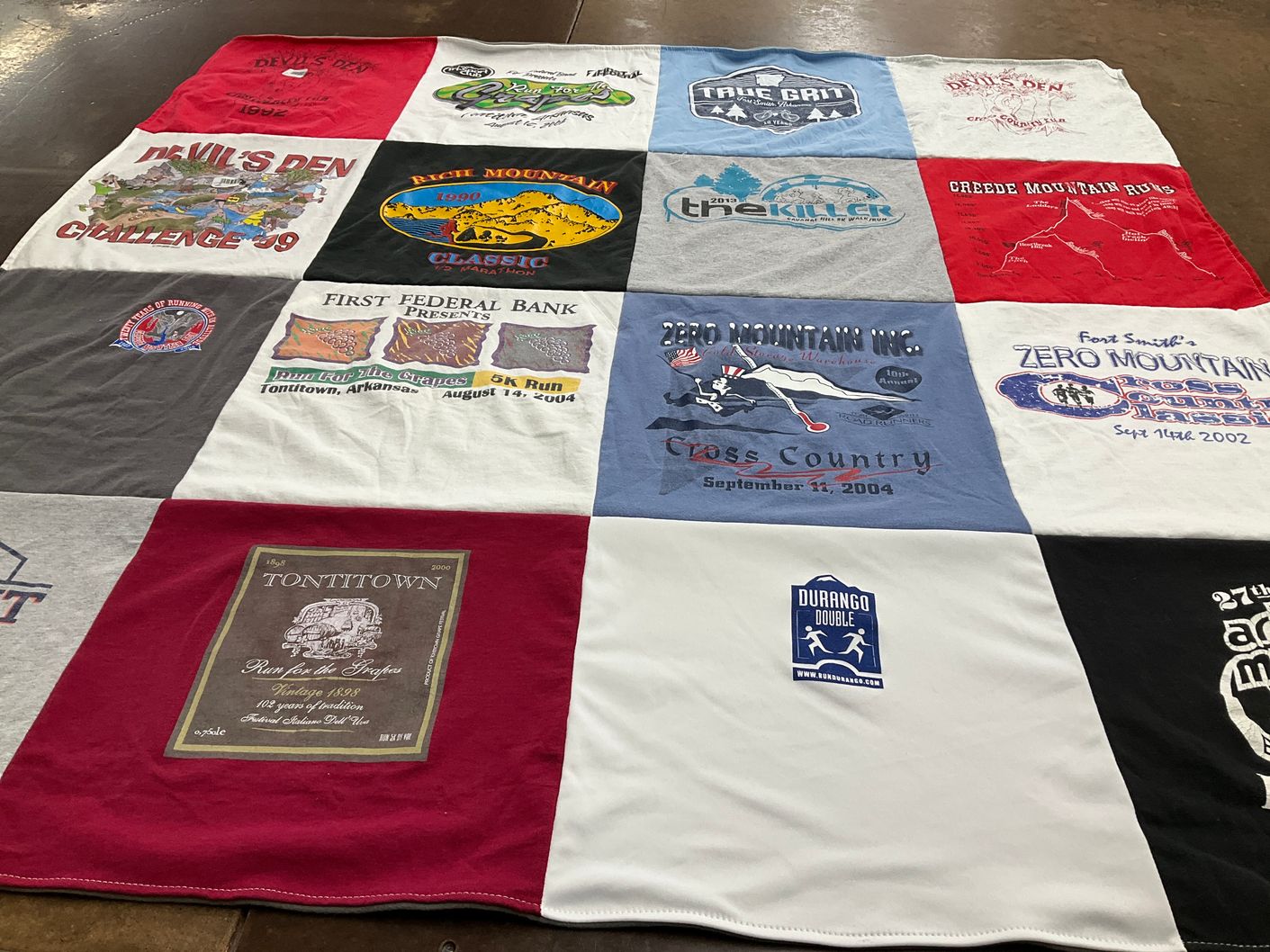 T-shirt quilt with running, mountain sports themes by Joan from AR