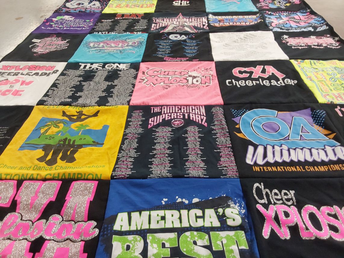 T-shirt quilt with cheerleading, dance themes by Janice from NC