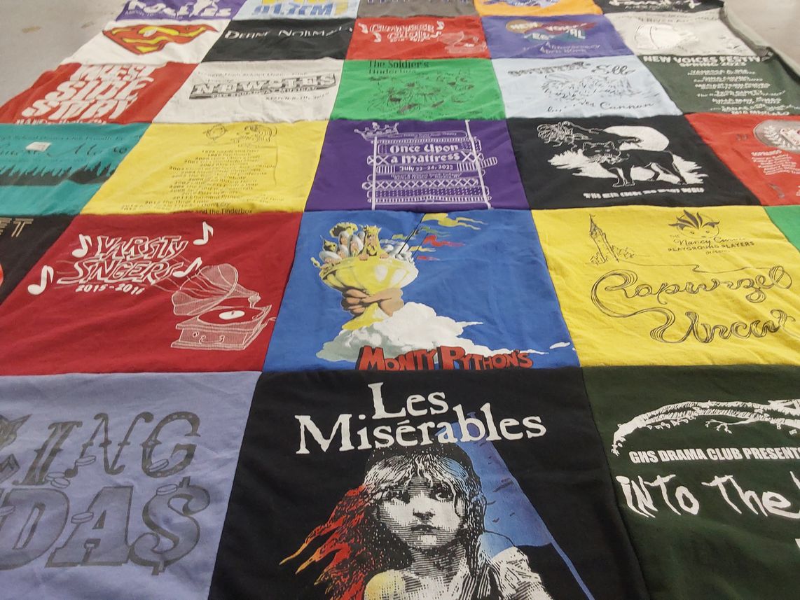 T-shirt quilt with theater, music themes by Amy from NY