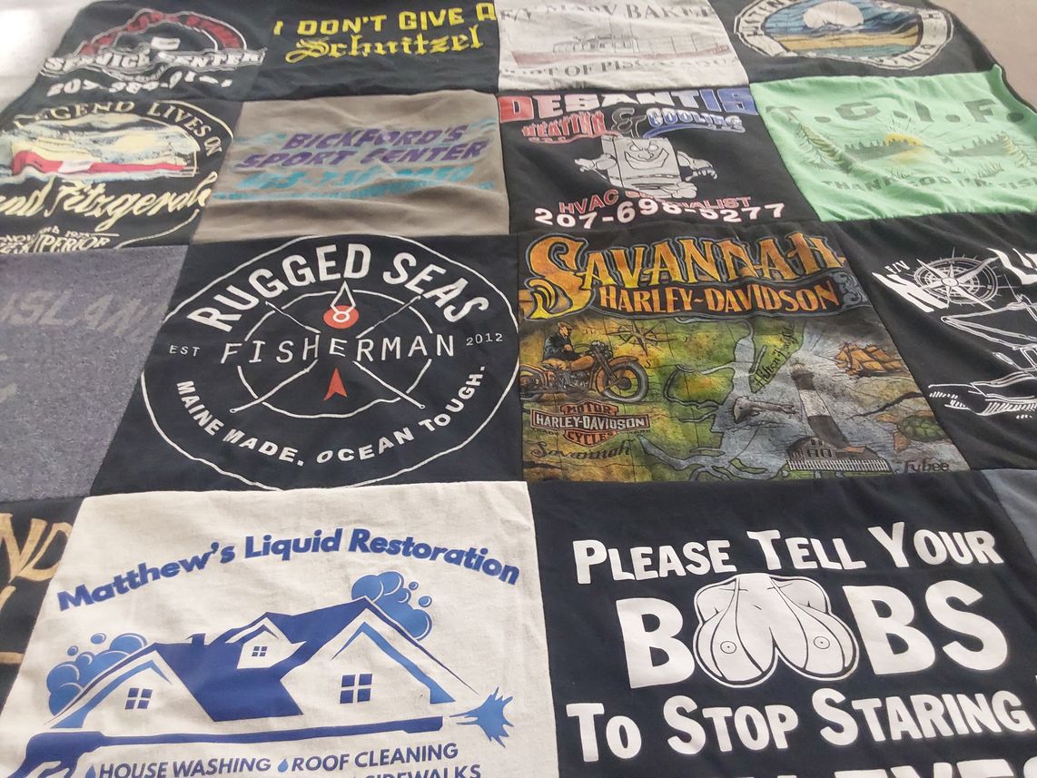 T-shirt quilt with fishing, motorcycling themes by Amy from ME