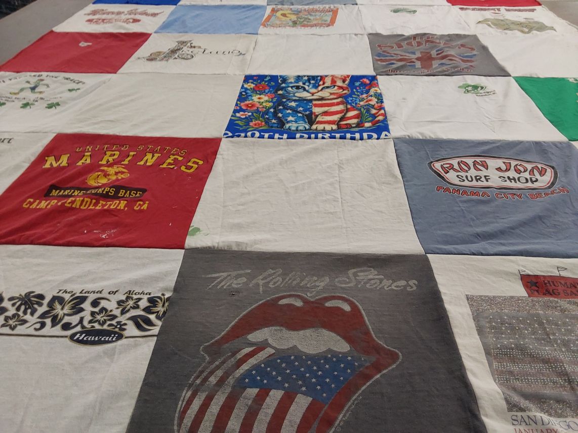 T-shirt quilt with military, surfing themes by Joan from GA