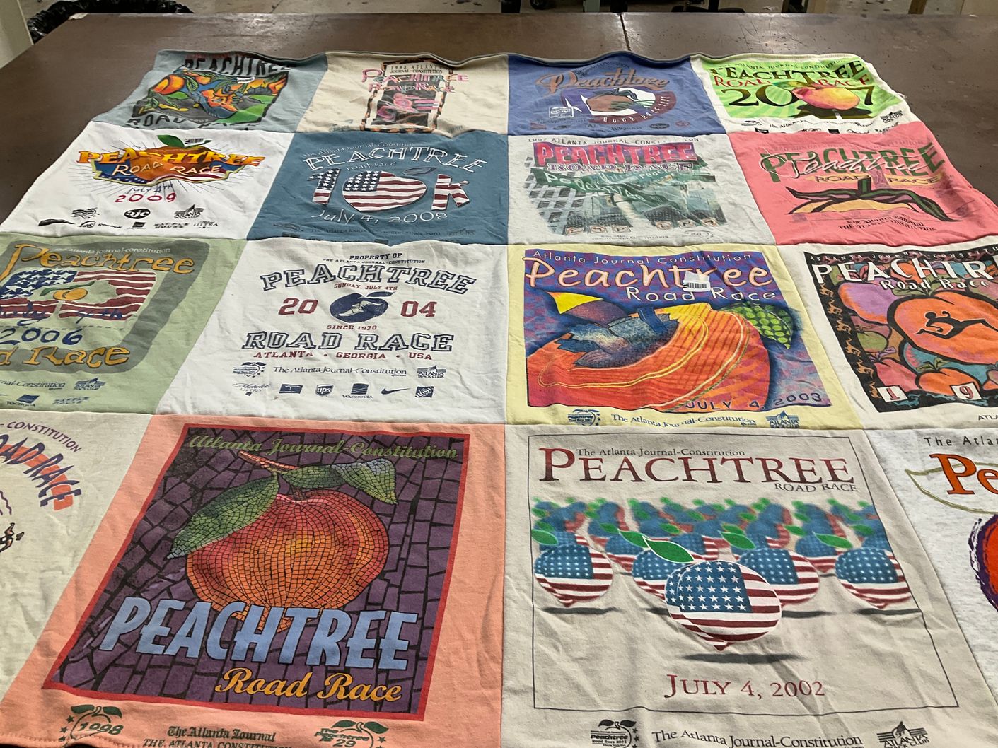 T-shirt quilt with running, sports themes by Madison from TN