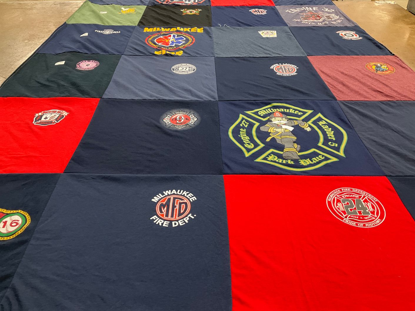 T-shirt quilt with firefighting, community service themes by Bill from WI