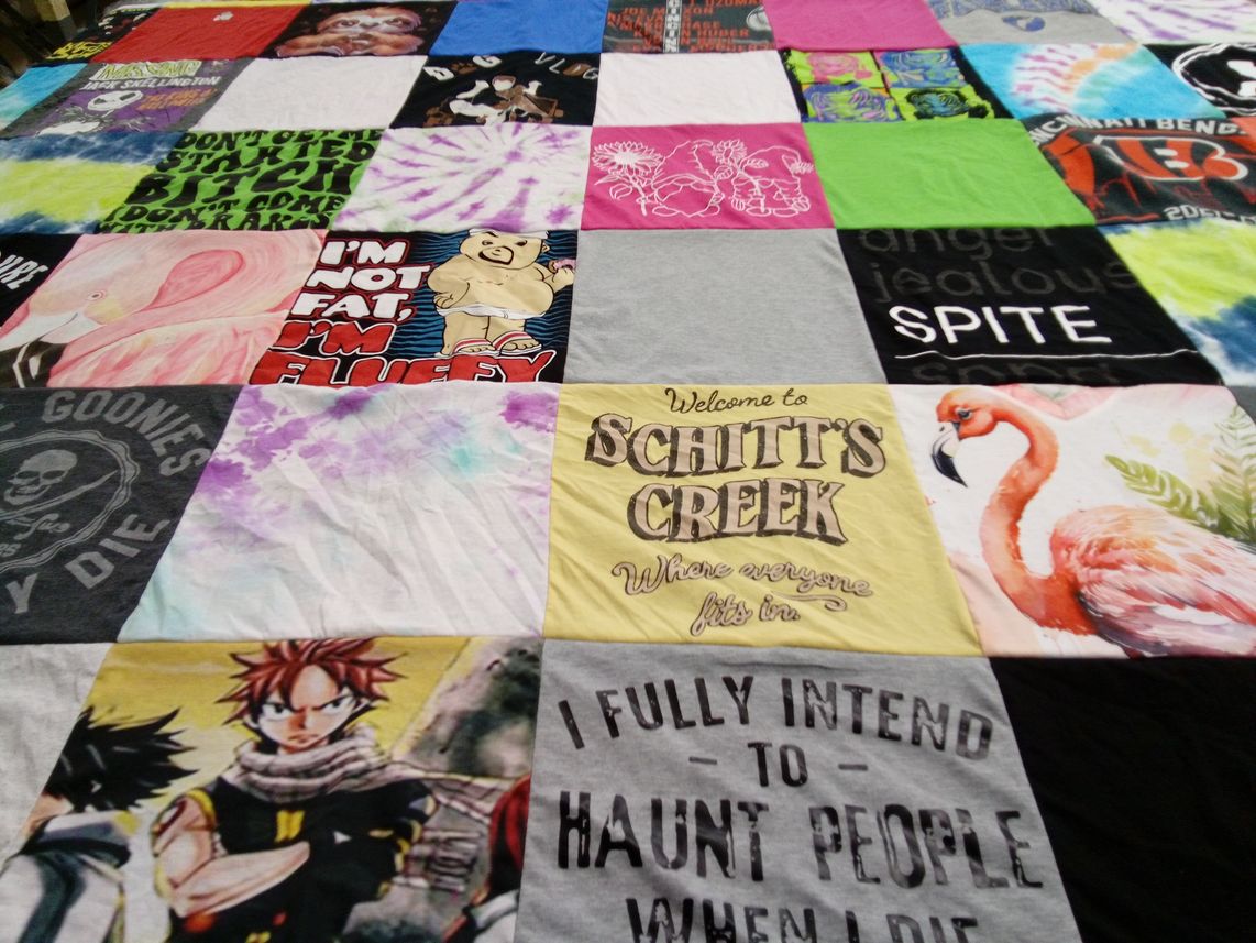 T-shirt quilt with tv shows, anime themes by Carla from OH