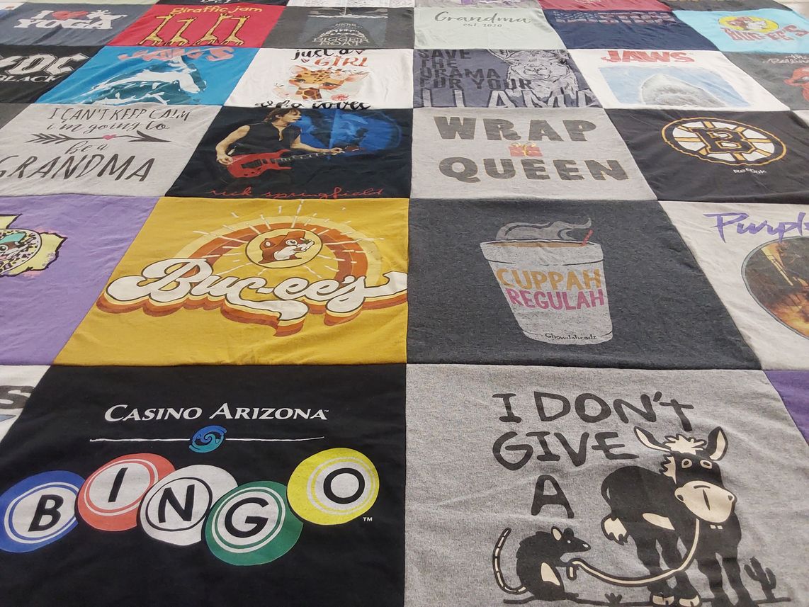 T-shirt quilt with family, entertainment themes by Jean from AZ