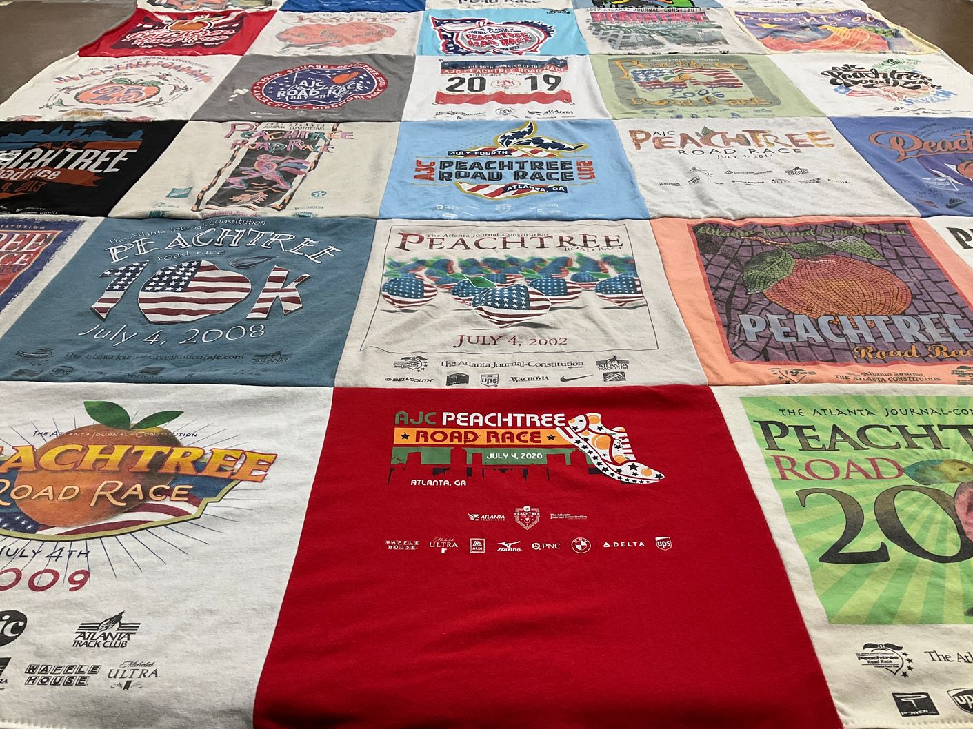T-shirt quilt with running, sports themes by Tekelia from GA