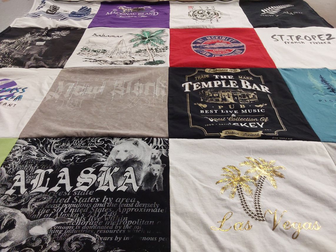 T-shirt quilt with travel, tourism themes by Patricia from MI