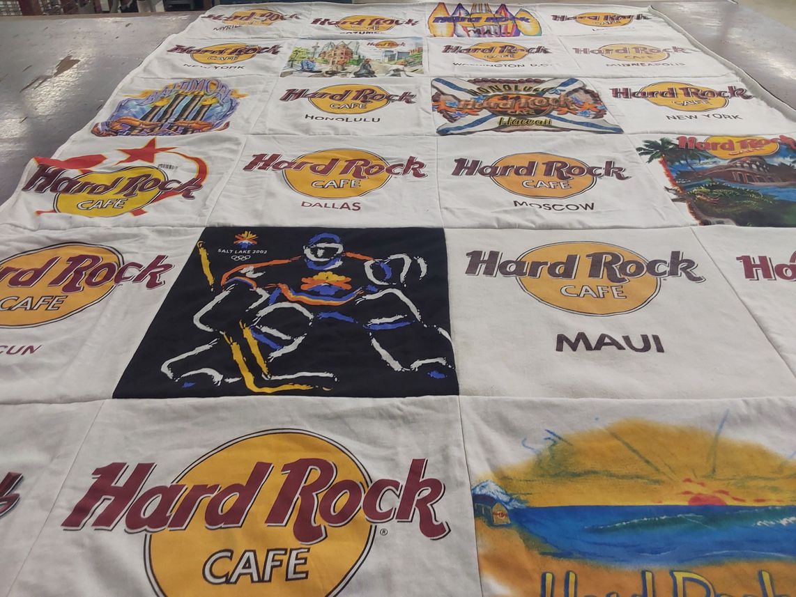 T-shirt quilt with music, travel themes by Dorothy from MA