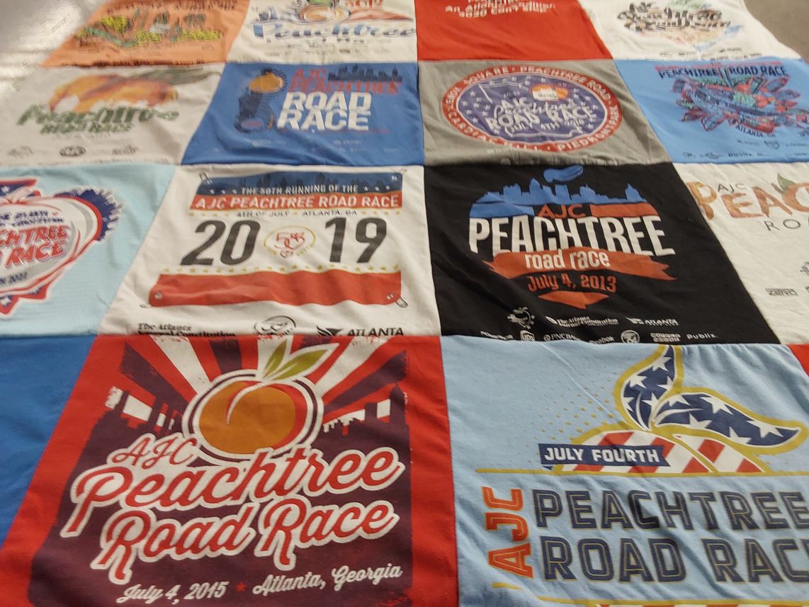 T-shirt quilt with running, sports themes by Suzanne from GA