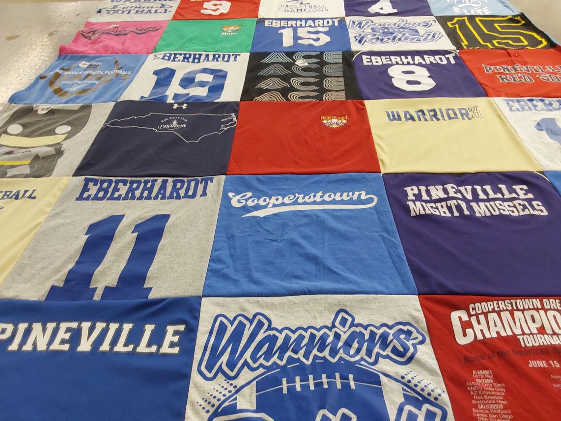T-shirt quilt featuring pineville mighty mussels by amy from SC