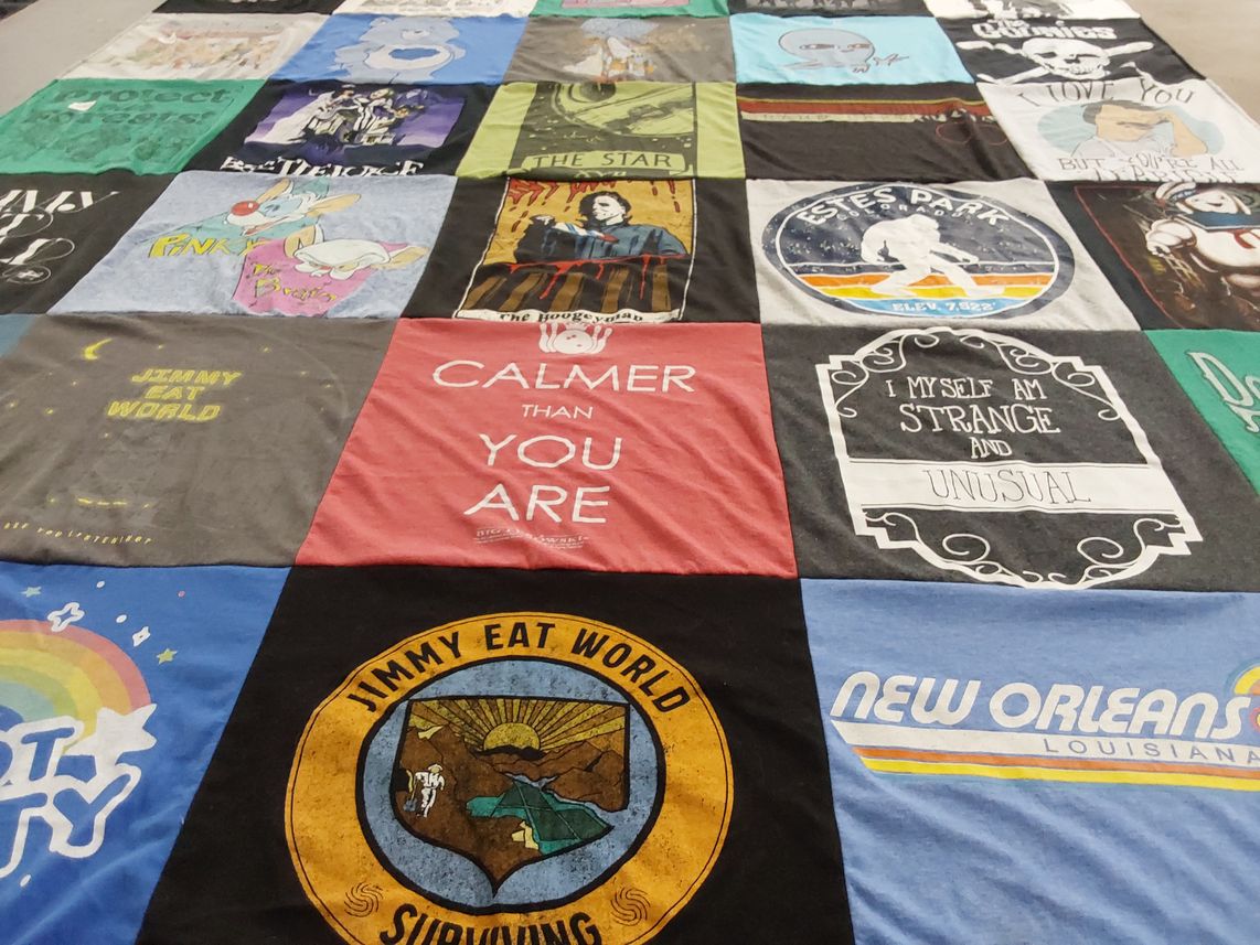 T-shirt quilt with music, pop culture themes by Beth from IL