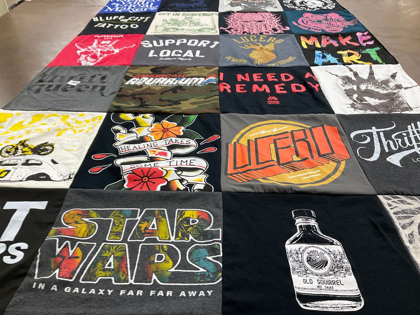 T-shirt quilt with art, music themes by Jennifer from IL