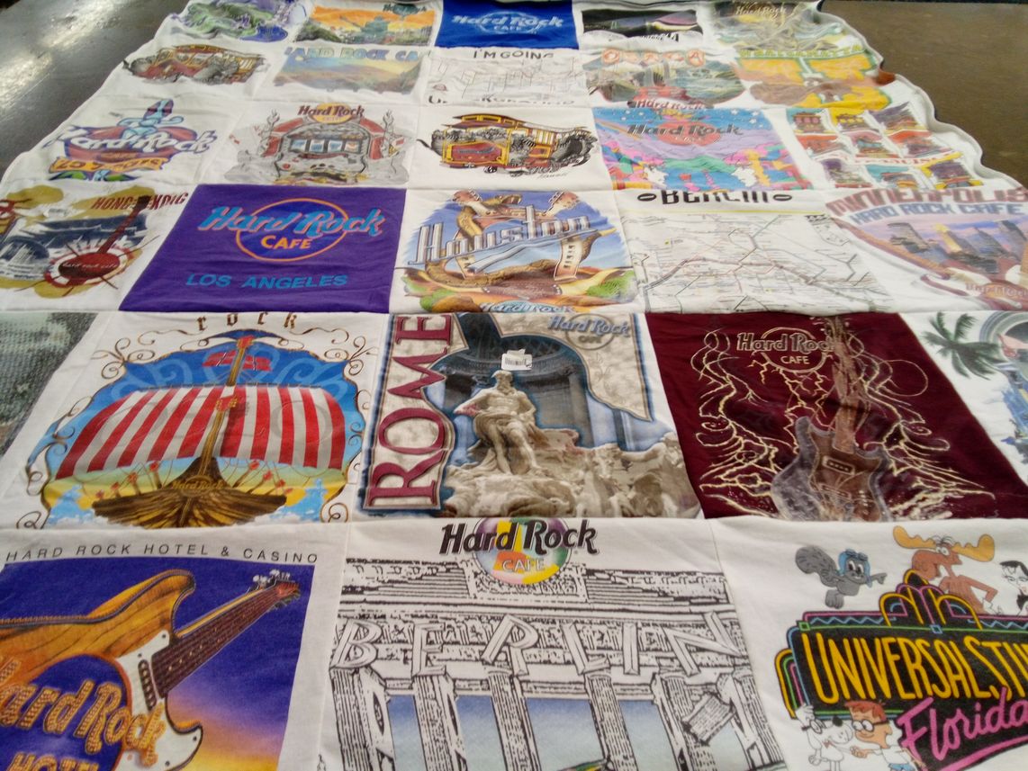 T-shirt quilt with collecting, travel themes by Carol from MA