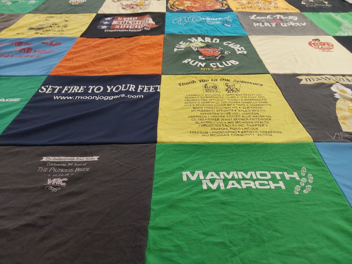 T-shirt quilt with running, community events themes by Jennufer from MI