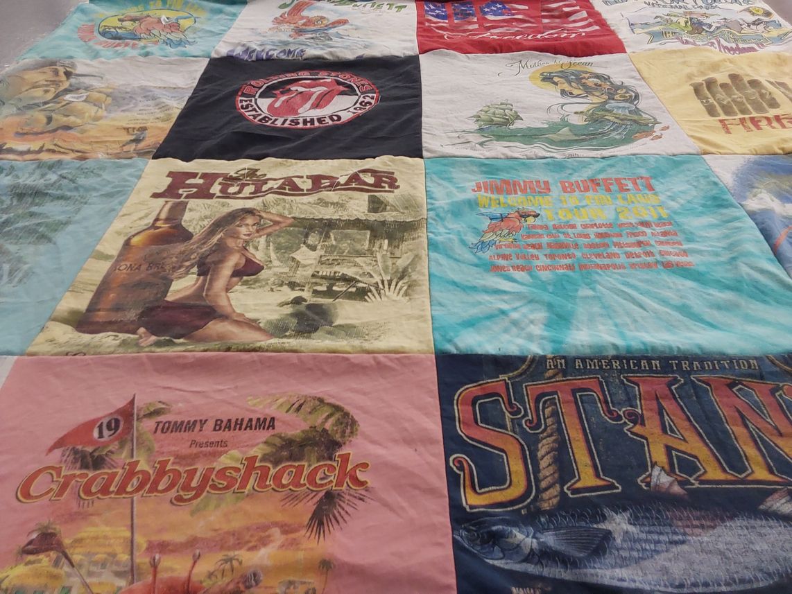 T-shirt quilt with beach, music themes by Joyce from IL
