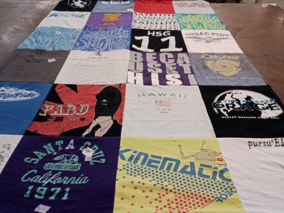 T-shirt quilt with education, cultural events themes by Victoria from CA