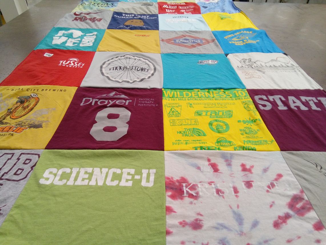 T-shirt quilt with cycling, brewing themes by Lara from PA