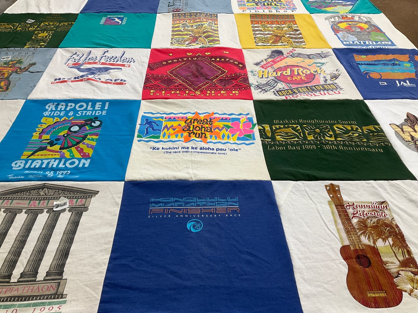 T-shirt quilt with travel, cultural events themes by MICHELE from KY