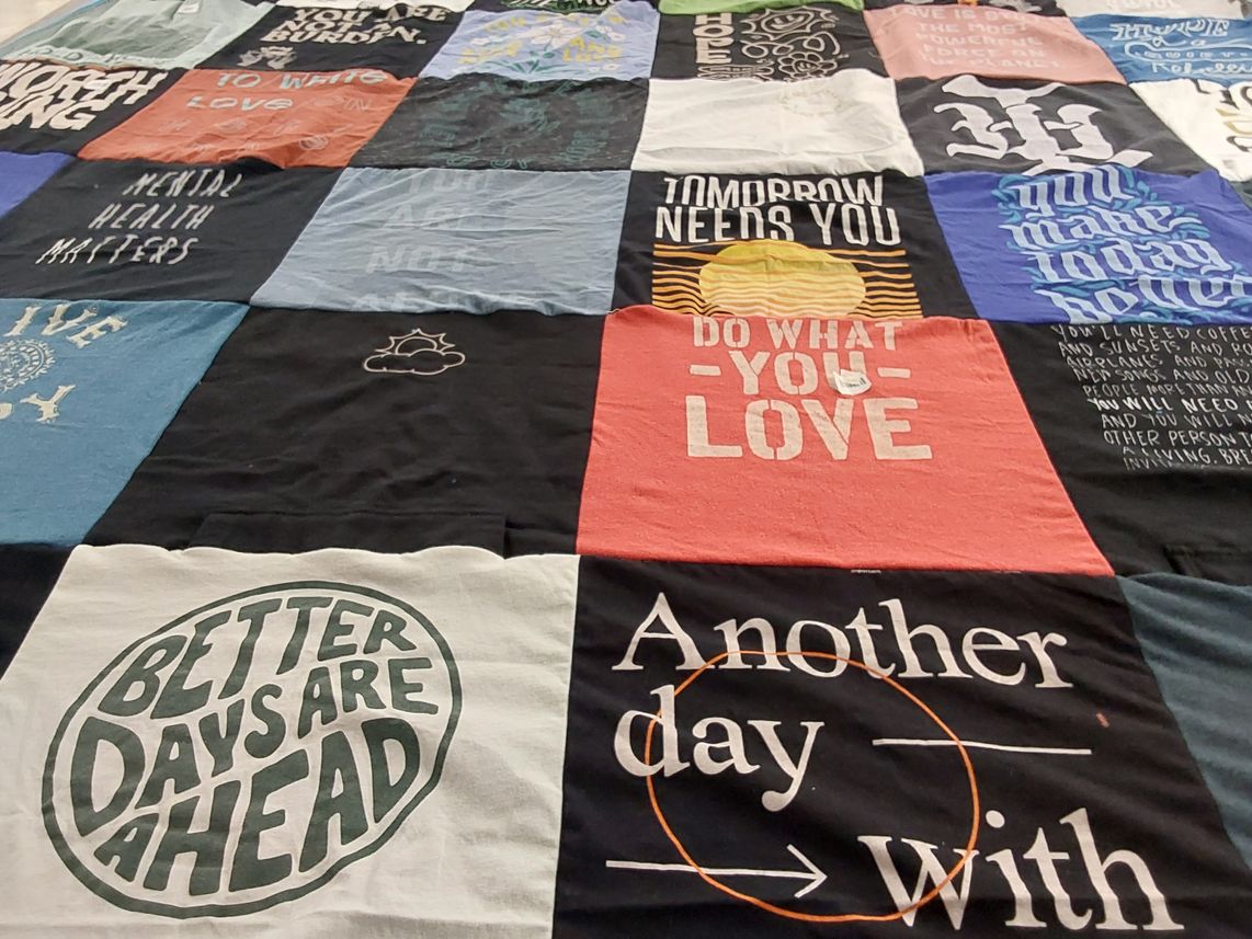 T-shirt quilt with mental health, positivity themes by Michelle from NC