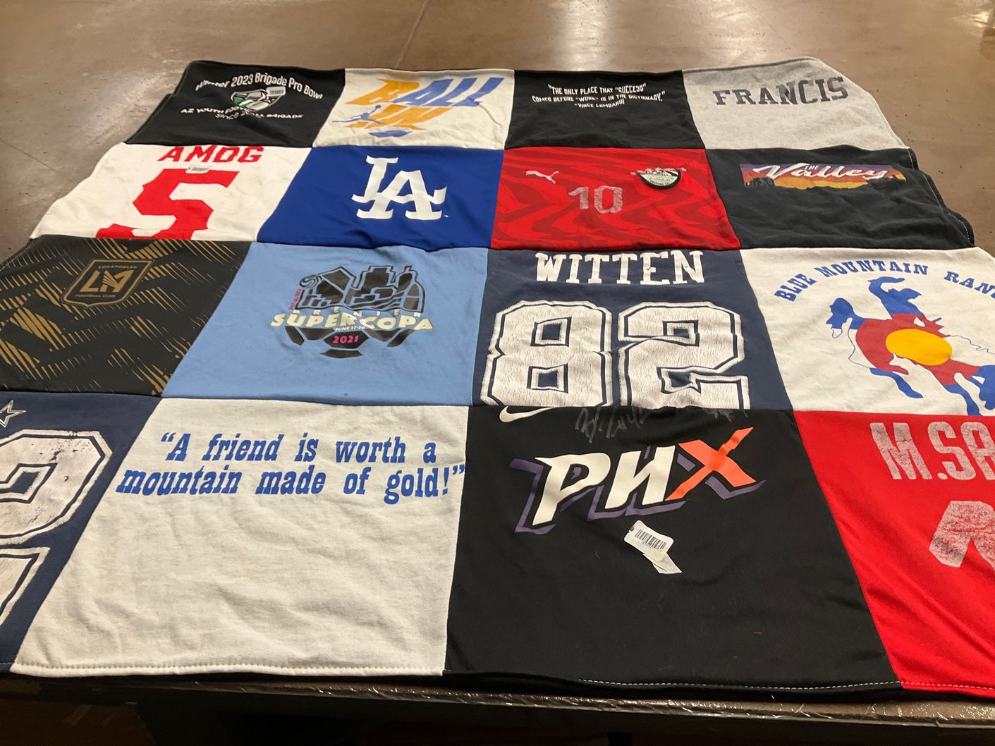 T-shirt quilt with sports, community themes by meredith from AZ