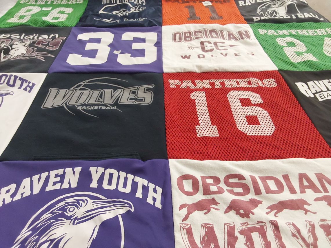 T-shirt quilt featuring obsidian middle school wolves, raven youth basketball by Benjamin from OR