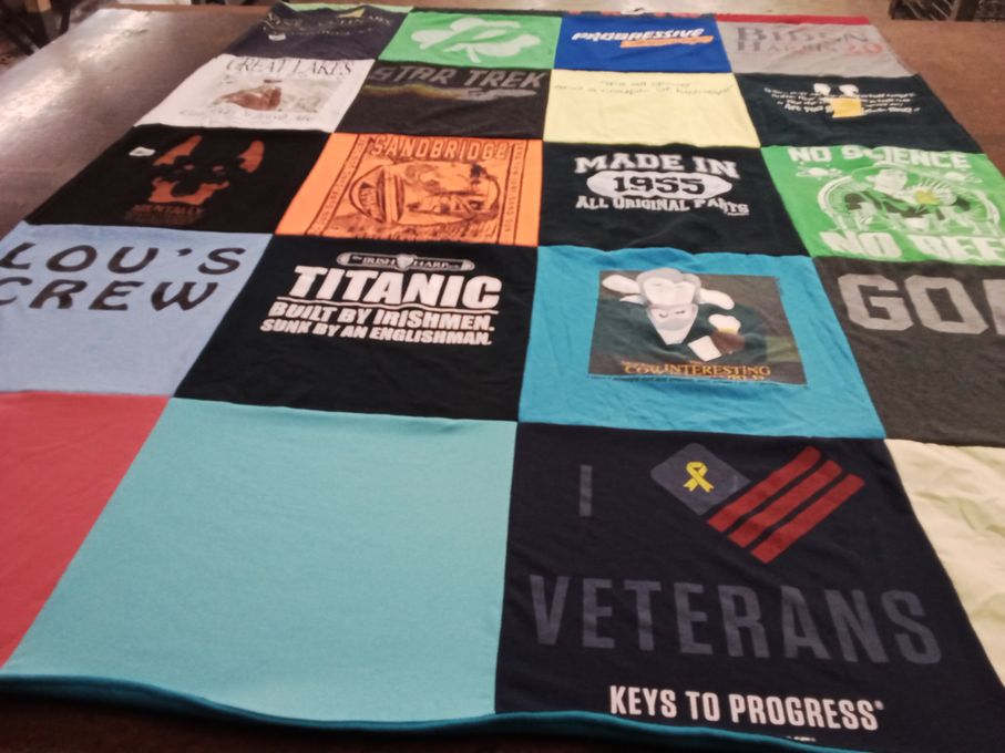 T-shirt quilt with history, movies themes by Laura from OH